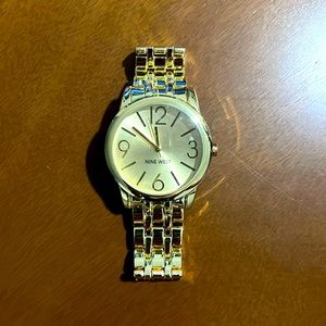 Gold Nine West women’s watch with stainless steel back. New!